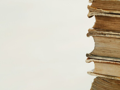 Close-up of antique books with a blank background, perfect for highlighting literature