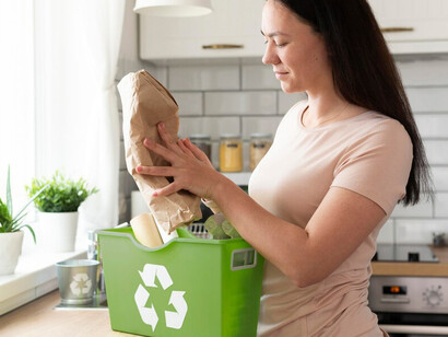 A woman proudly holds a stylish paper bag, showcasing her commitment to eco-friendly shopping and sustainable lifestyle choices