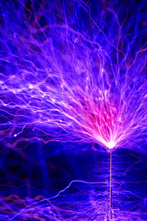 The Tesla coil unleashes a breathtaking display of electrical arcs, showcasing the beauty of alternating current in action