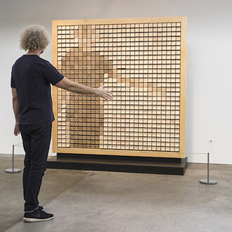 Daniel Rozin, Wooden Mirror, 2014, Wood, motors, video camera, custom software, microcontroller, 6 x 6 ft / 1.8 x 1.8 m. Courtesy bitforms gallery, New York​