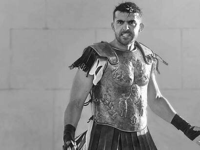 Moroccan actor Mourad Zaoui in costume and acting out a scene from the film "The Forgiven"