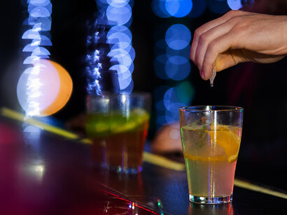 A disturbing scene showing a drink being tampered with at a bar in a case of drug-facilitated sexual assault