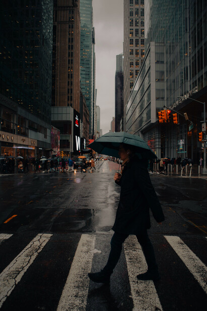 A person is walking across the street, New York City, United States