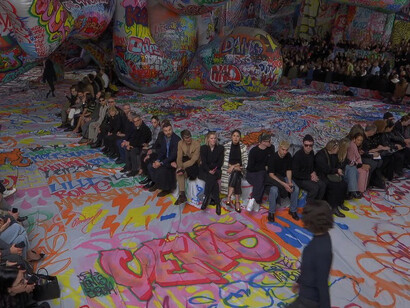 A 3km canvas of global street art transforms into monumental inflatables, creating a bold and immersive backdrop for the Diesel FW25 runway show