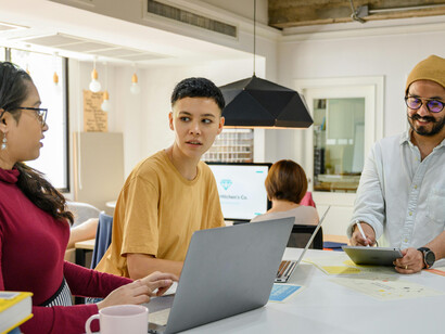 Young innovators in a startup office brainstorming ideas with their technology team