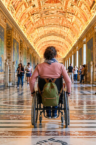 A wheelchair user explores the Vatican Museums, highlighting the importance of accessibility at one of the world's most visited cultural landmarks