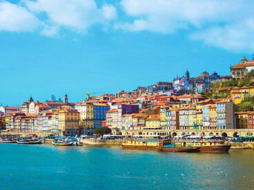 Colourful waterfront buildings along Porto, Portugal, reflecting the city’s timeless beauty and relaxed rhythm of life