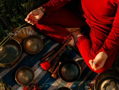 Person sitting by detailed bowls