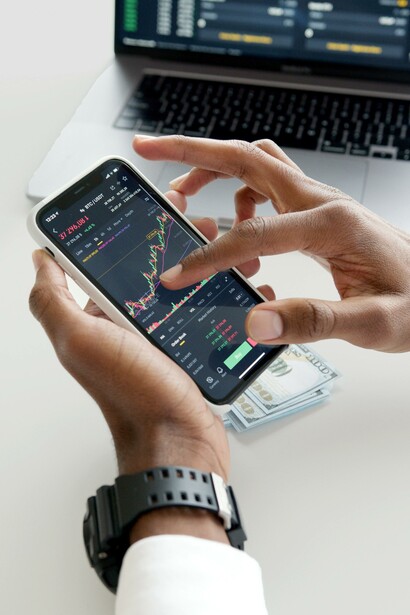 A person looking at a phone. Advertising has permeated every aspect of our everyday lives