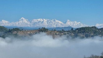 Spectacular view of snow clad Himalayan peaks from Dhamas Village, India 