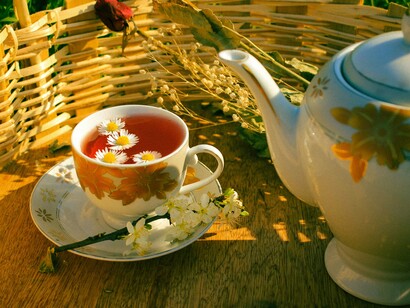 A freshly brewed herbal tea with flowers, reflecting how small moments of calm contribute to balanced blood pressure
