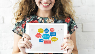 "Hello" in different languages in bubbles on an ipad
