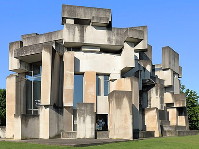 The Wotruba or Trinity Church in Vienna, a Brutalist-style church, was constructed based on an idea by artist Fritz Wotruba (1907–1975) and initiated by Margarethe Ottillinger (1919–1992). Architect Fritz Gerhard Mayr (1931) designed the church, located in the Mauer district of the 23rd district of Liesing, offering a northeast view