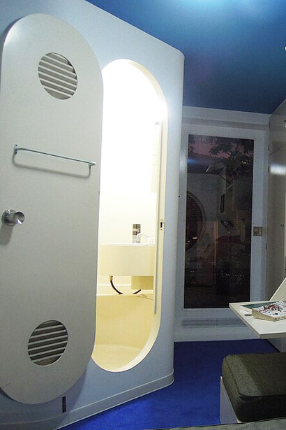 A capsule from the Nakagin Capsule Tower displayed near Roppongi Hills Mori Tower in Tokyo, Japan, showing its compact interior design