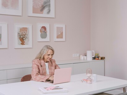 A senior citizen using her laptop as she engages in her efforts to be a part of the silver economy