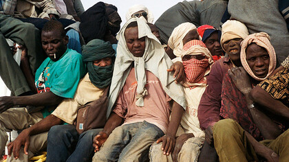 A tightly packed group of immigrants