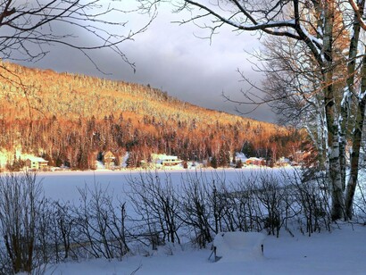 Nature shows the differences and disasters of climate change. Mountains and trees melted by the heat and the snow nearby is still frozen. 