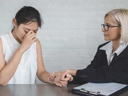 Woman in distress seeks support from a psychotherapist