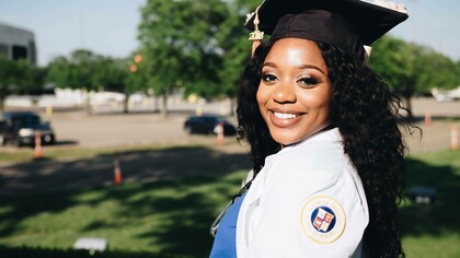 A woman who recently graduated from a higher learning academy is a feat of success
