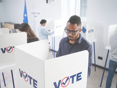 Diverse voters cast ballots at polling stations during European Union elections