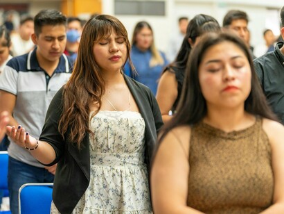 A church filled with seekers and believers, reflecting the courage to hold on to faith against all odds