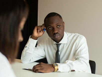 Man ruminating while at work