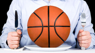 A man with a knife and fork, and a basketball