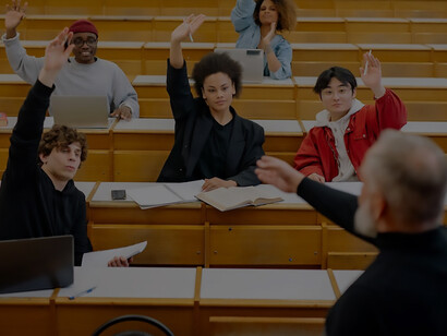 In a lecture hall, a professor imparts knowledge to a captivated audience of students
