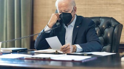 President Joe Biden reacting to a letter received by Honorary President Jeffrey Levett of the World Philosophical Forum