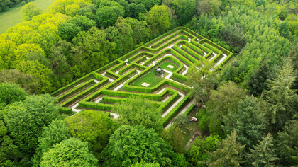 A garden maze represents the complicated nature of problems and the need for innovative problem solving techniques