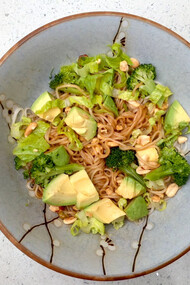 A bowl of avocado and wasabi noodles