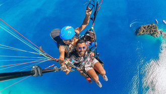 A man paragliding on vacation in Fethiye, Muğla, Turkey