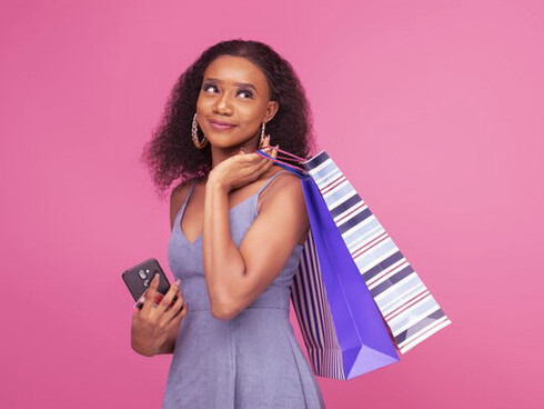 A smile on her face and bags in tow, this shopper is caught in the momentary joy of a new purchase, yet the documentary reminds us that these short-lived thrills contribute to the environmental and financial toll of overconsumption