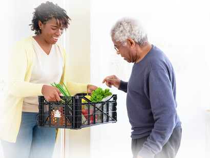 The daughter brings her father with AD plenty of fresh fruits and vegetables to keep him healthier