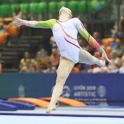 A female gymnast during the floor routine