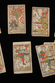Twelve cards from a tarot deck with French text