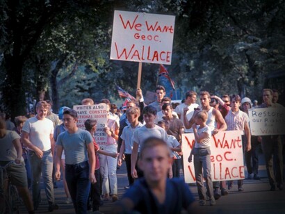 White protesters march in Marquette Park, Chicago, with signs showing support for segregationist politician George C. Wallace, in August 1966