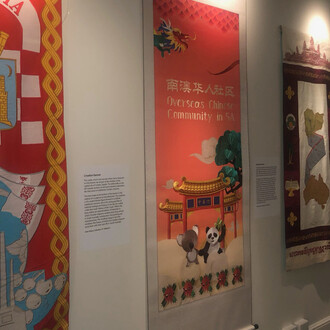 Aussies! The Migration Museum Banners Project, exhibition view. Courtesy of Migration Museum