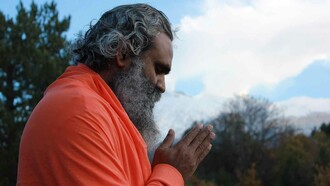 A man in deep mediation trying to channel and navigate the compassion he feels for himself and the world