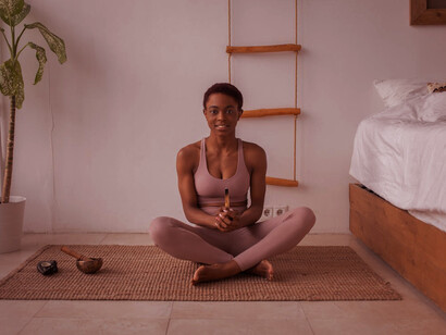 In deep meditation, she embodies the essence of yoga’s transformative journey, reflecting the profound impact of women who have shaped its modern practice