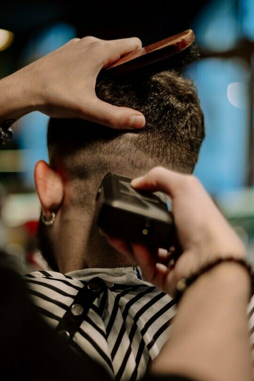 A grooming session focused on detail and presentation, symbolising how appearance can shape confidence and perception