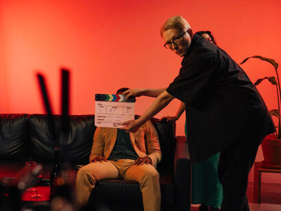 Filmmakers consult on the direction of a scene, representing the mentorship that’s vital for emerging talent to thrive in an industry that’s long been starved of guidance