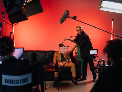 A director discusses the shot with the cinematographer, demonstrating the attention to detail and collaboration needed to create innovative films in a system that lacks proper support