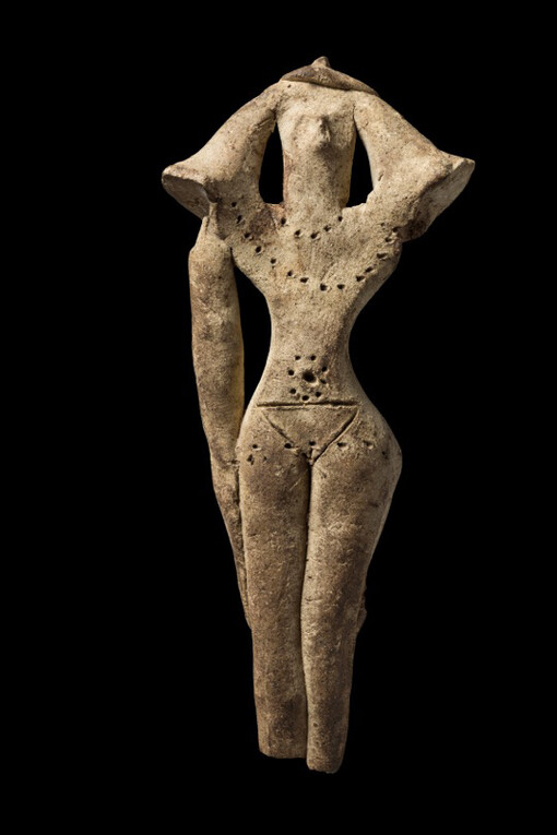Tattooed fertility goddess figurine, front and back