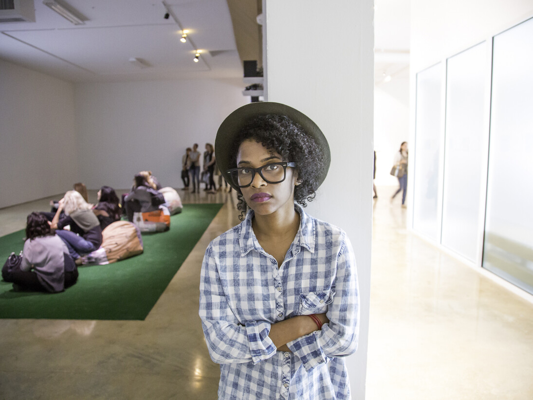 Tameka Norris, standing in the midst of her exhibition Meka Jean: Recovery at Emerson Dorsch. Courtesy Emerson Dorsch. Photo by Monica McGivern