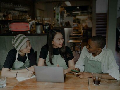 A group of students discussing their latest successes in the hunt for jobs