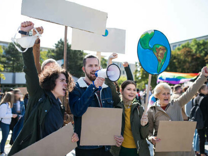 A group of activists with banners, rallying for human rights and justice to drive societal change