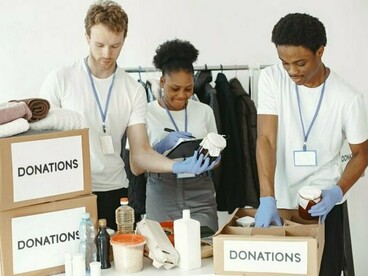 A team organizing relief supplies, symbolizing the tangible impact of community-driven compassion