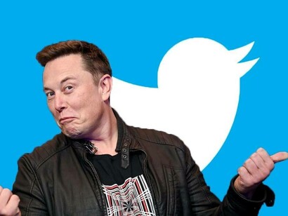Elon Musk giving the sideways thumbs as the owner of Twitter
