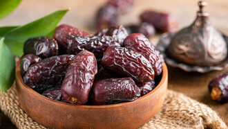 Enhance your culinary creations with a captivating display of Mejhool dates in a bowl